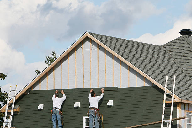 Professional Siding Replacement technician working in Elkton, FL